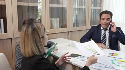 Business man having important conversation on smartphone while sitting at desk  Stock Footage 171966707
