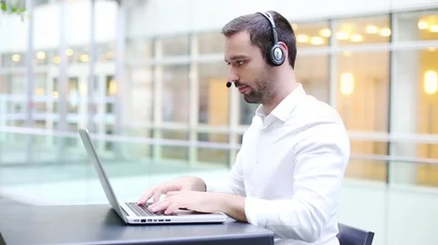 Business man with headset Video stock 59825327