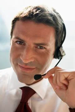 Business man with headset, skyping Stock Photos