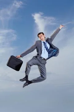 Business man, heel click and sky with suit, happiness and freedom for success Stock Photos