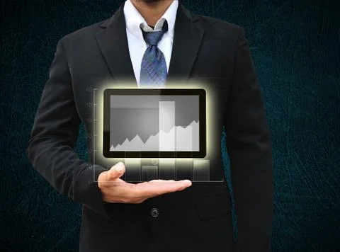 Business man hold tablet computer and graph report Illustrazione stock