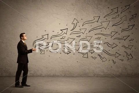 Business man holding arrow signs Stock Photos