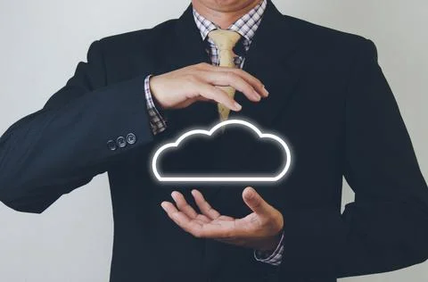Business man holding cloud computer network icon and data connection icon in  Stock Photos