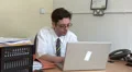 Business man intently typing HD Footage