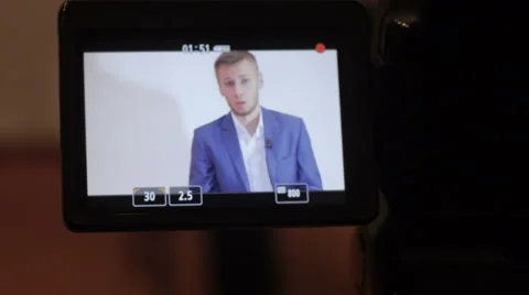 Business man interviewed looking into camera Stock Footage 64233546