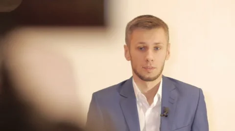 Business man interviewed looking into camera Stock Footage 64233739