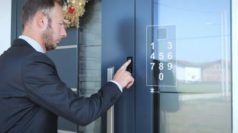 Business man locking smart home door with password before leaving. Stock-Footage 254547247
