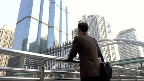 Business man looking forward to opportunity in modern city Stock Footage 132633890