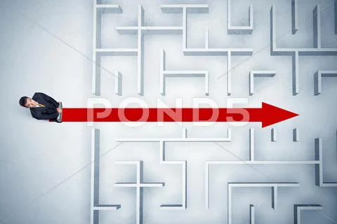Business man looking at maze with red arrow Stock Photos