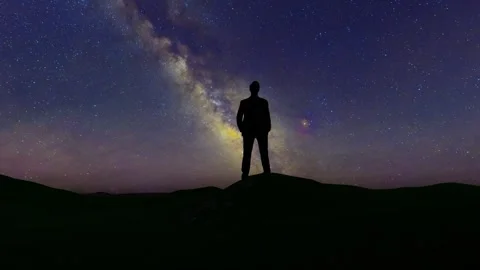 Business man looking up at the starry sky and meditating Video stock 313774891
