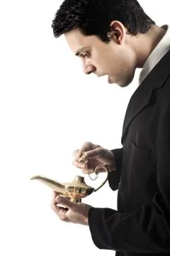 Business Man with Magic Lamp Stock Photos