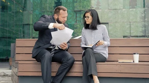 Business man manager submitting papers for signature to his boss woman Stock Footage 112336975