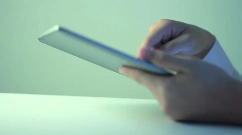 A business man is playing with iPad Stockbeeldmateriaal 36627788