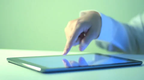 A business man is playing with iPad Stockbeeldmateriaal 36629667