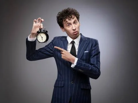 Business man pointing at time Stock Photos