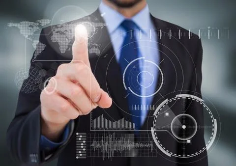 Business man pointing at white interface with flare in blurry grey room 写真素材