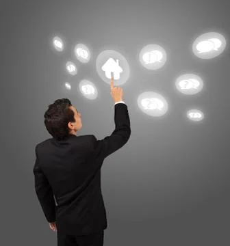 Business man pressing touchscreen button Foto stock