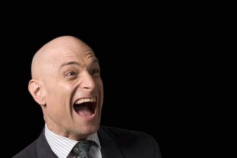 A business man pulling a funny face Stock Photos