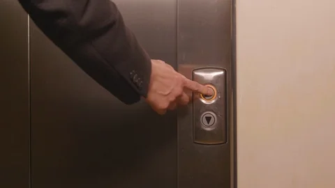 Business man pushing button for calling elevator and coming into lift Video stock 99476687