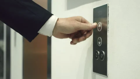 Business man pushing red button for calling elevator in modern business office Video stock 165057021