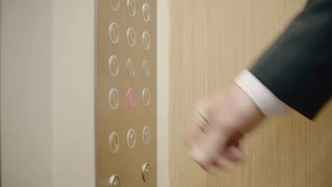 Business man pushing red button for calling elevator in modern business office Video stock 165222902