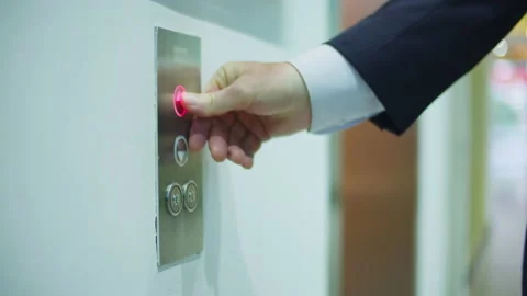Business man pushing red button for calling elevator in modern business office Video stock 165843503