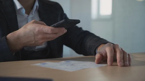 Business man scanning QR code from check. slow motion Stock Footage 119462731