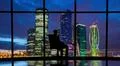 The business man sitting in the office near the window with a night city view Photo