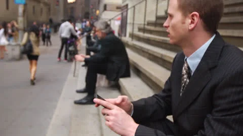 Business Man Sitting on Steps with Cell Phone Vídeos de archivo 22761189