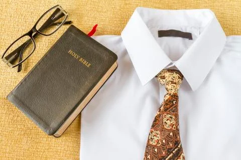 Business man style clothes and Holy Bible at home Стоковые фото