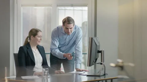 Business man suggesting a solution to his colleague Stock Footage 66914070