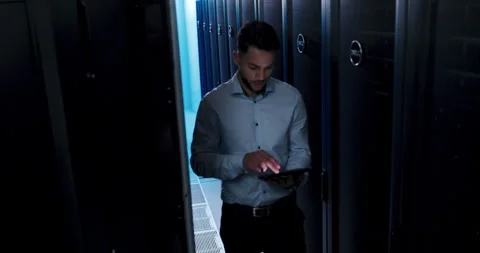 Business man, tablet and server room for inspection, programming and cloud Stock Footage 262001188