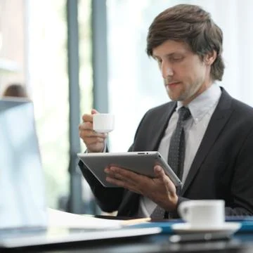 Business man with tablet computer Stock Photos