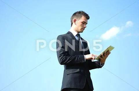 Business man with tablet Stock Photos