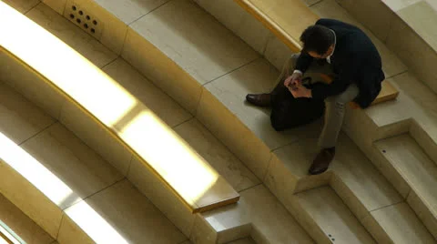 Business Man Takes a Break - using Cellphone -HD Stock Footage 25963903