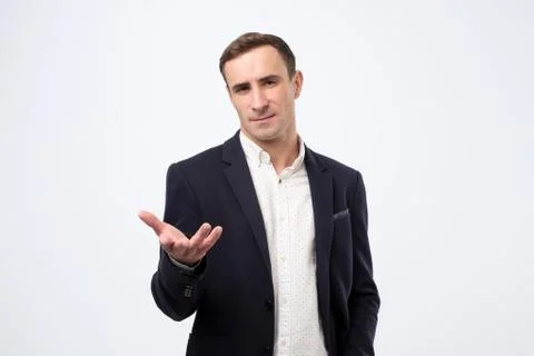 Business man talking during presentation and using hand gestures trying to co Stock Photos