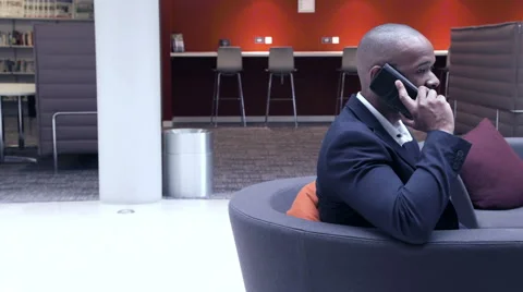 Business man talking on phone in office lobby Vídeo Stock 59384441