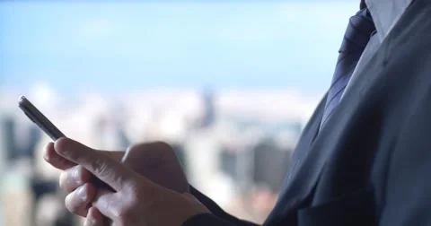 Business man texting using mobile cell phone technology city background Stock Footage 54258978