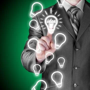 Business man touching light of idea Stock Illustration