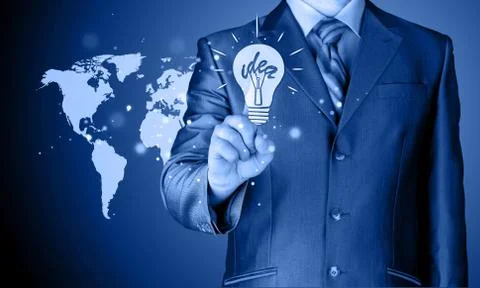 Business man touching light of idea Illustrazione stock