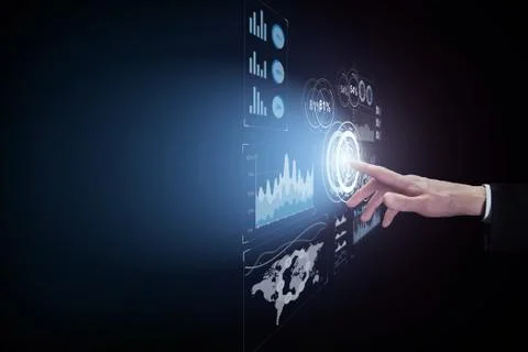 Business man touching virtual interface button on dark background 写真素材
