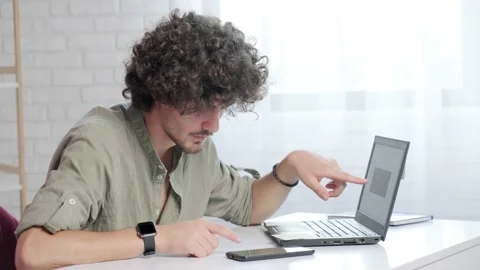 Business man trader using mobile phone app and laptop analytics. Stock Footage 168976734