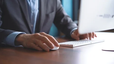 Business man typing on computer keyboard in office Stock Footage 123916361