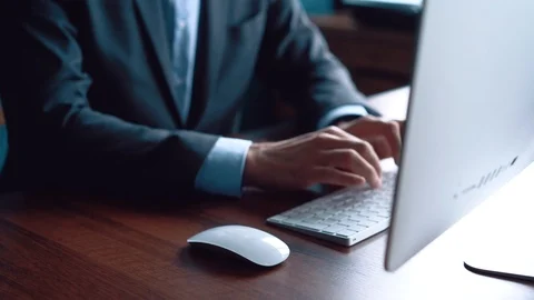 Business man typing on computer keyboard in office Stock Footage 123916364