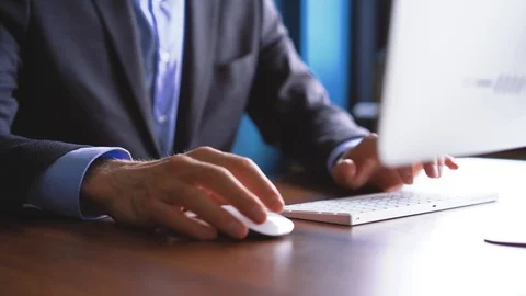Business man typing on computer keyboard in office Stock Footage 123916369