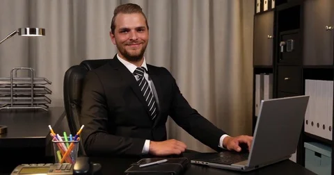 Business Man Typing Computer Laptop Keyboard Optimistic Look Camera Office Room Video stock 73579179