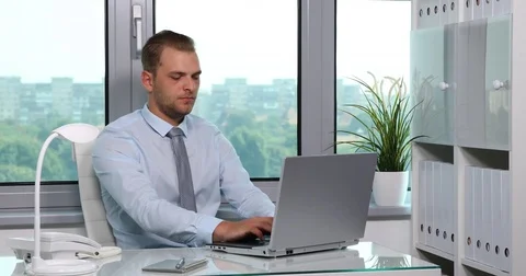Business Man Typing on Computer Laptop Keyboard Happy Male Working Office Room Stock Footage 77016278