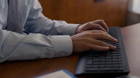 Business Man Typing on computer at work Stock Footage 94382962