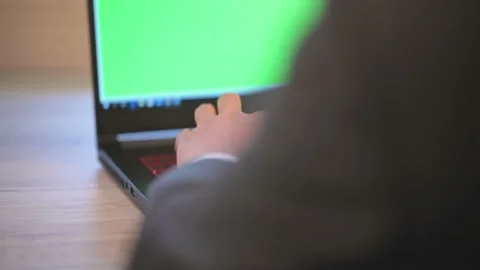 The business man is typing data on a laptop on the desk Stock Footage 137516252