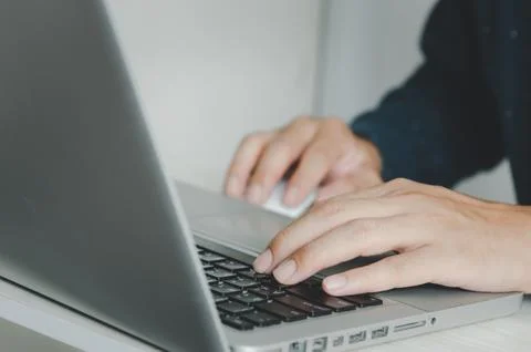 Business man typing on keyboard computer laptop. Stock Photos